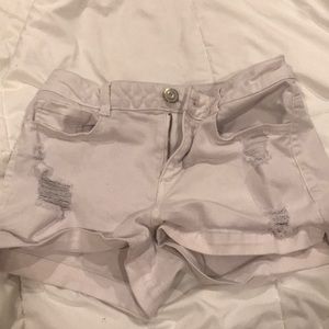 White ripped jean shorts